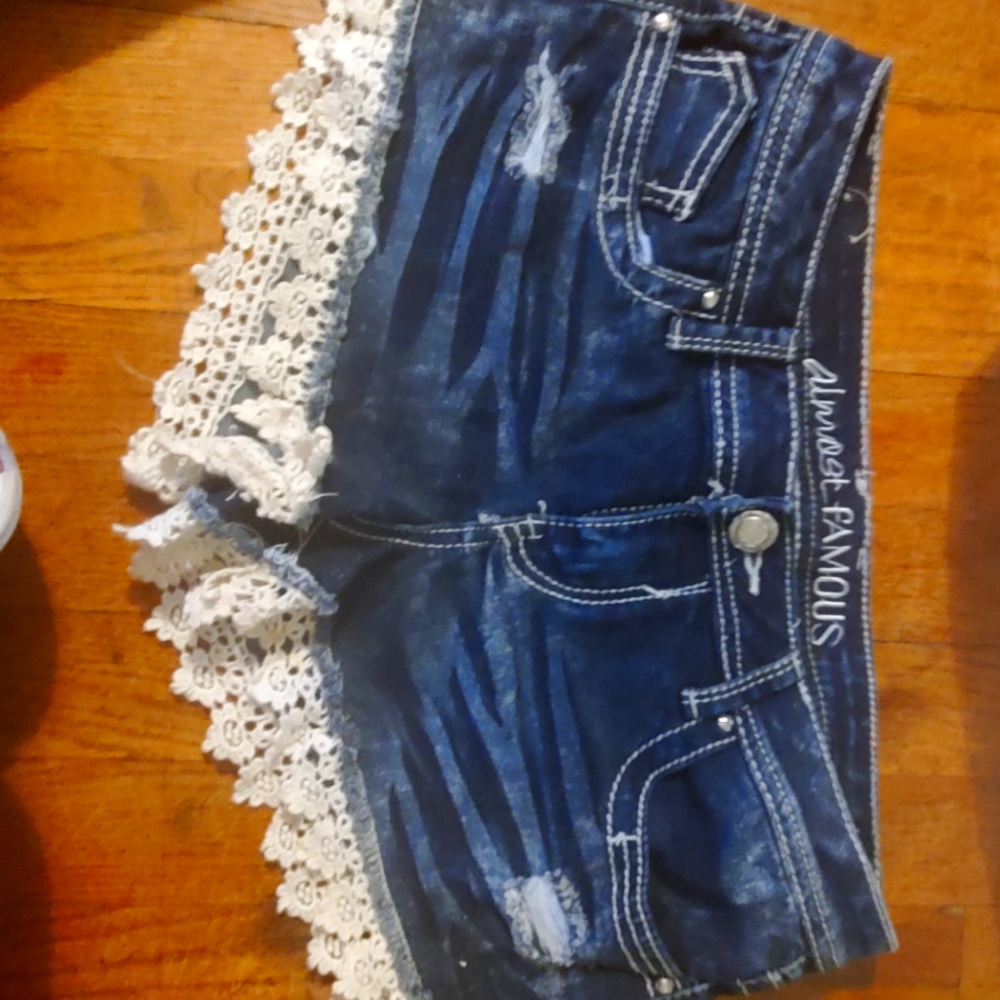 Distressed jean shorts with lace